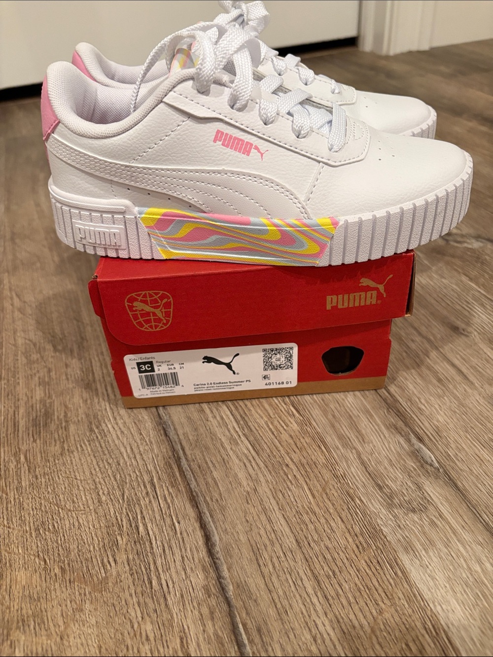 Puma White Low-Top Kids Sneakers with Pink & Yellow Swirl Accent